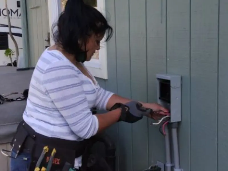 Licensed electrician wiring an exterior subpanel in Vacaville
